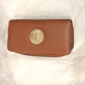 Woman’s faux leather wallet. Double side with zippers.